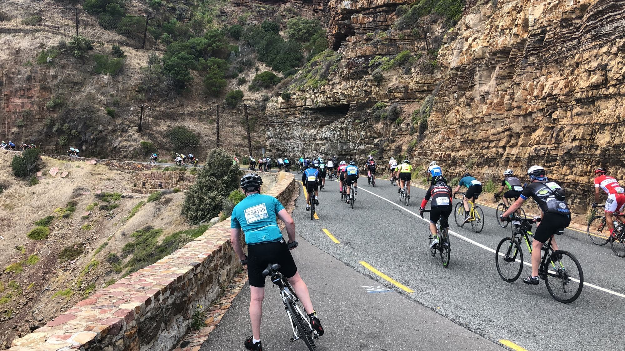 Riders descending Chapman's Peak during the Cape Town Cycle Tour
