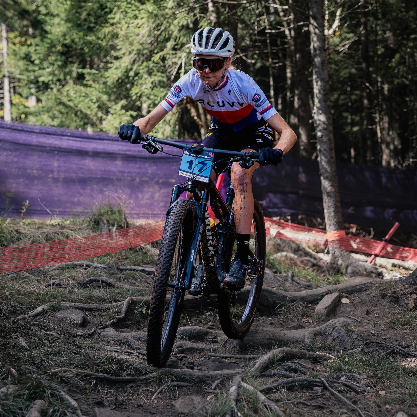 Women's cross-country World Cup racer through the trees